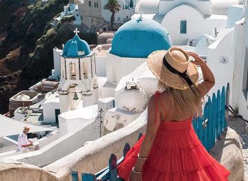 25 destinations santorini oia blonde girl greece